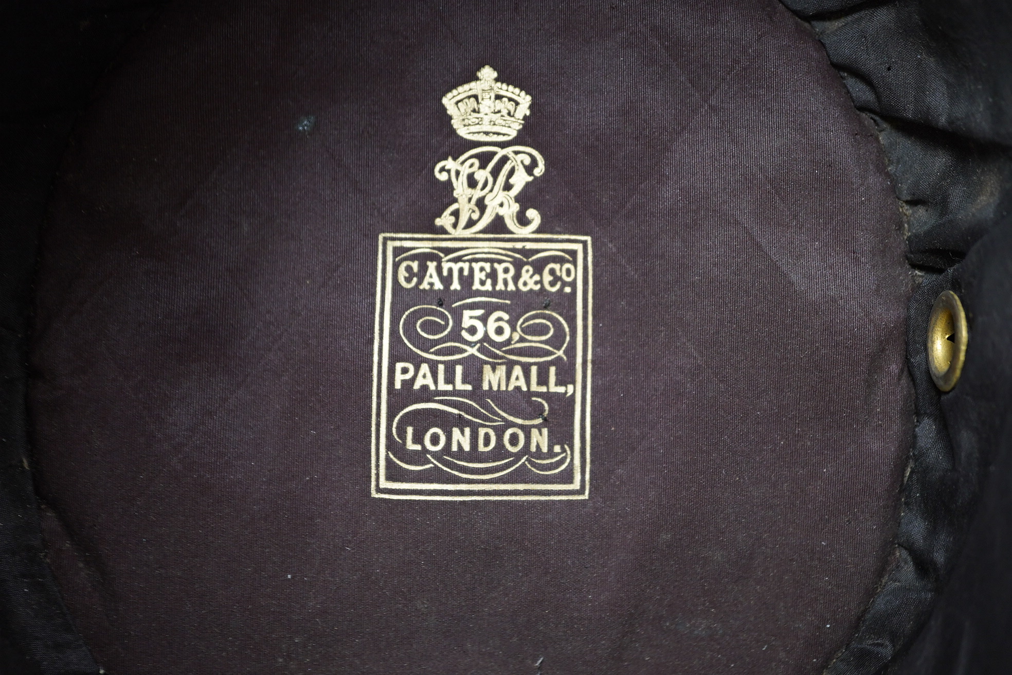 A Victorian tin cased Scottish Rifles officer's shako by Cater & Co. Pall Mall, London, with cap badge for the Cameronians, Applied plaque to lid engraved R. Robertson Esq. 2nd Scottish Rifles. Condition - fair to good,